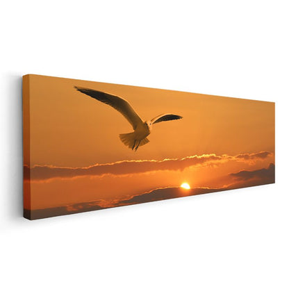 Gün Batımı Martısı - Turuncu Gökyüzünde Süzülen Martı Kanvas Tablo